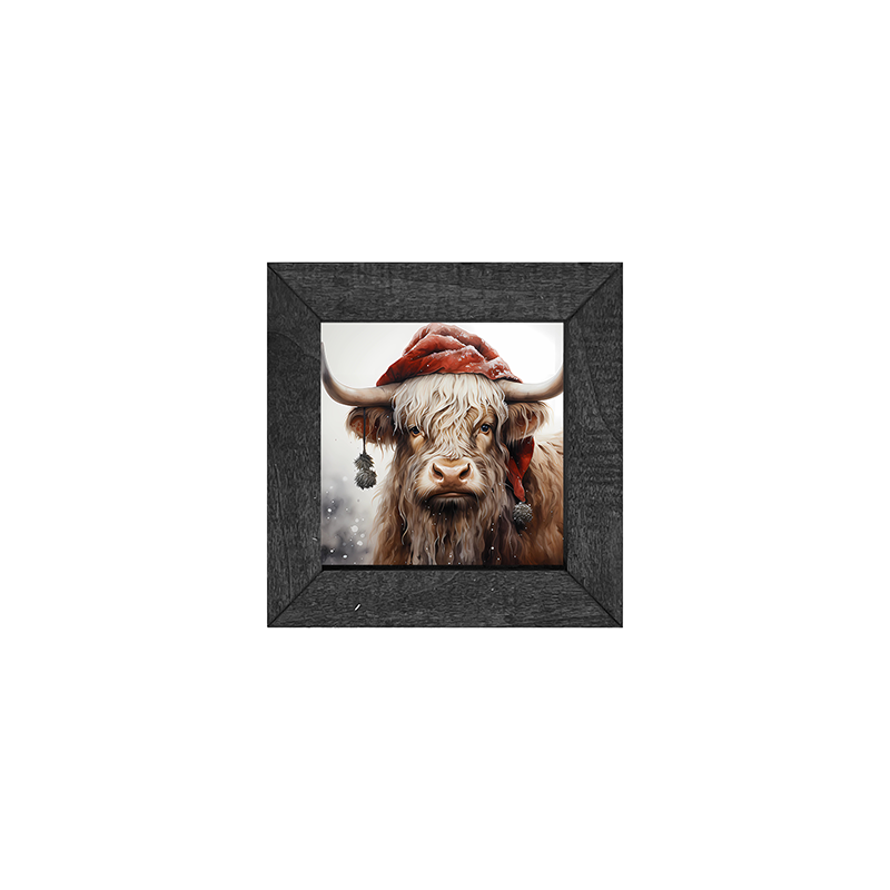 Highland cow with Santa hat