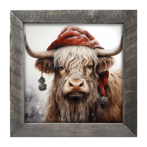 Highland cow with Santa hat